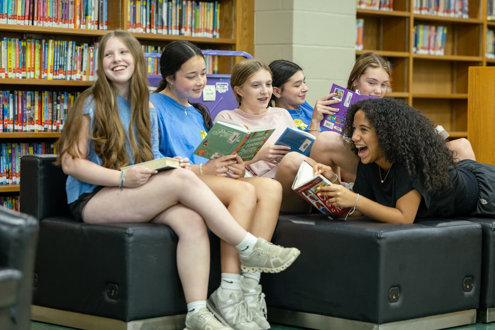 PHMS students reading together in the library