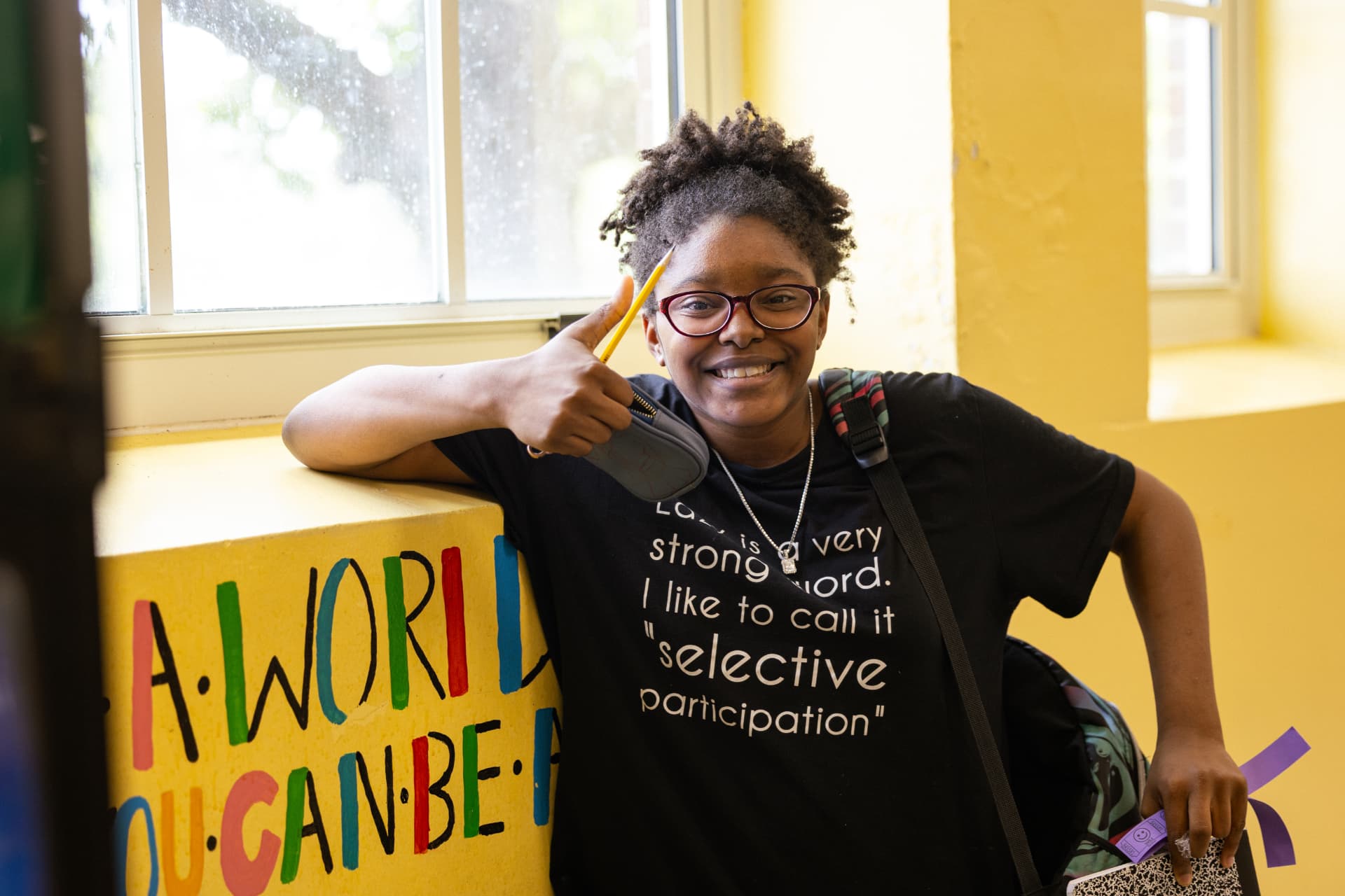 A PHMS student smiling and giving a thumbs up